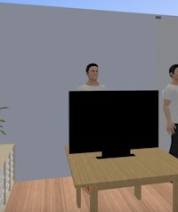 a man is standing in front of a tv